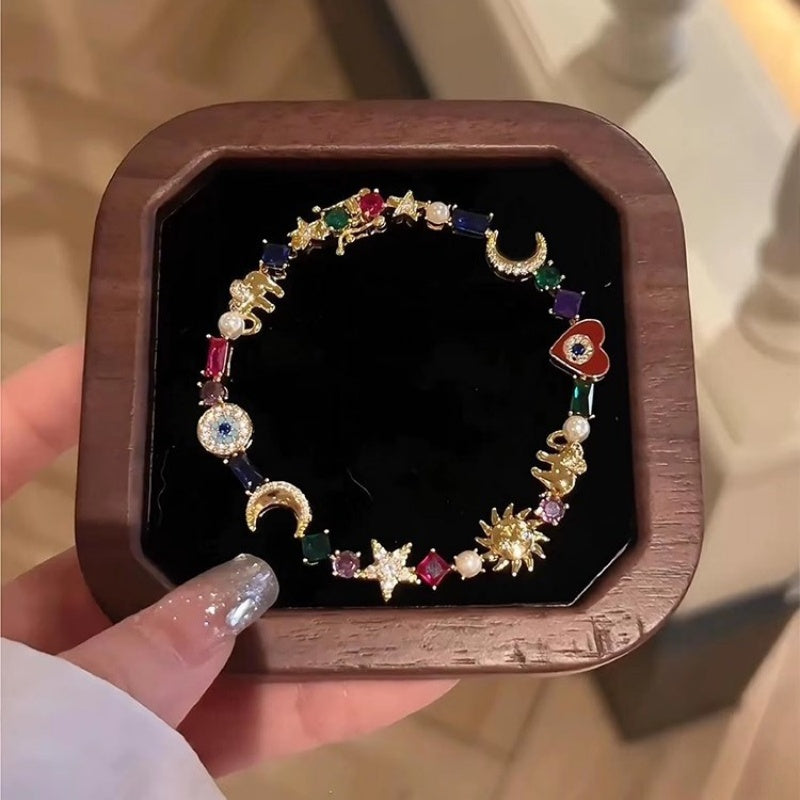 💫 LIMITED-TIME 50% RABATT + 2 kaufen 1 gratis! ✨ Himmelscharme-Armband – Sonne, Mond, Sterne, Kristalle, Goldton 🪐